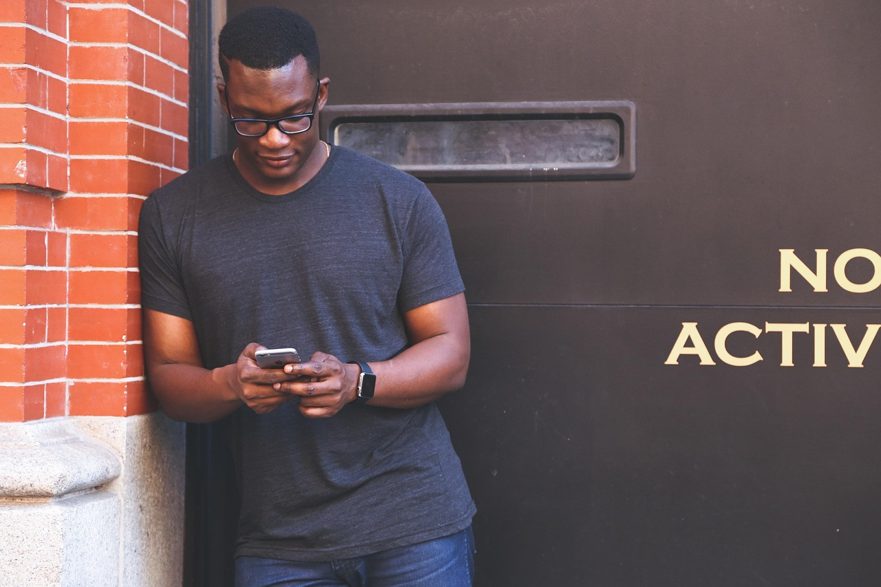 Representative image: young man using smartphone