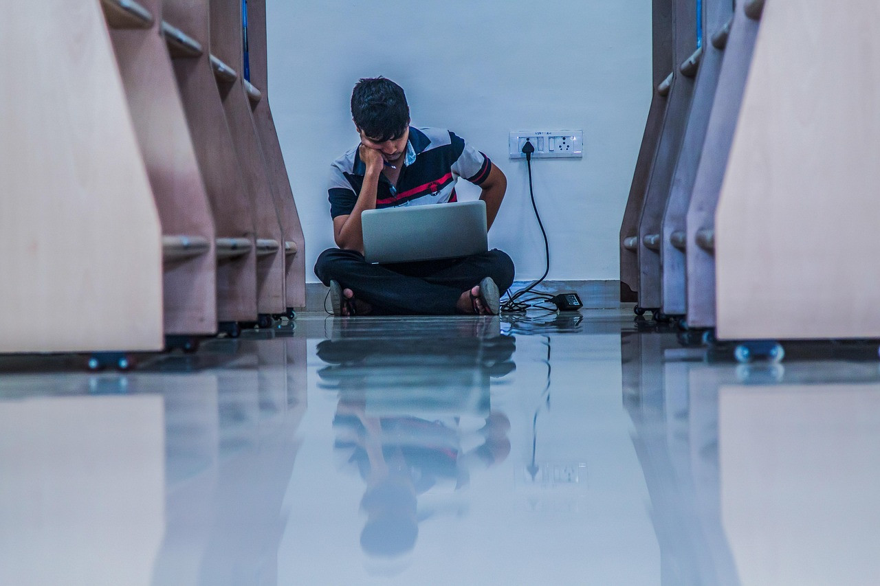 Representative image: college students working on laptops