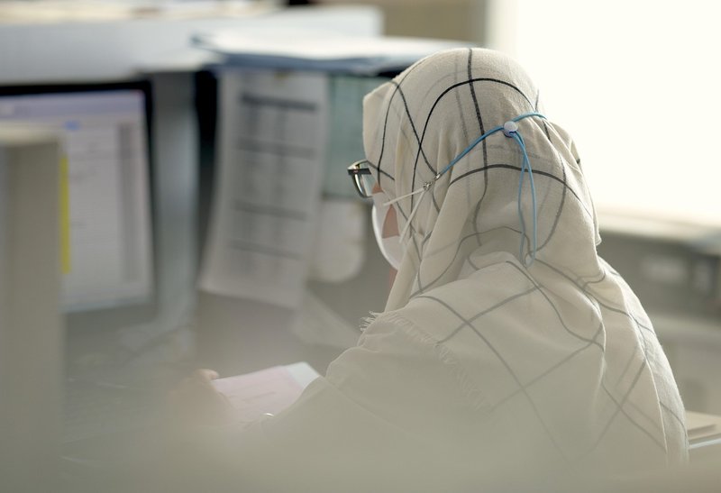 Representative image: office worker laptop desk