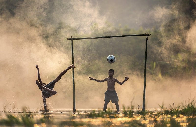 Representative image: teenagers playing football outdoors
