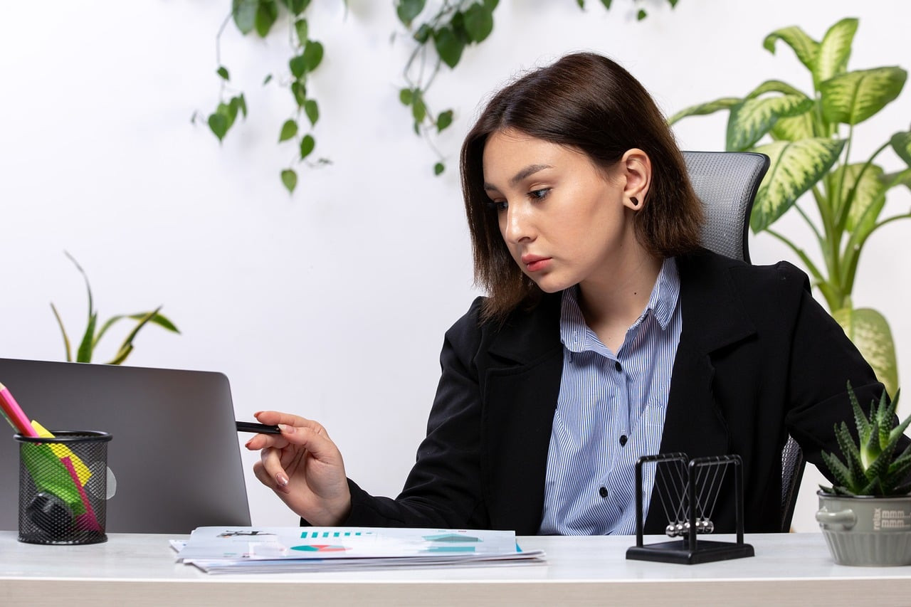 Representative image: young professionals working on laptops