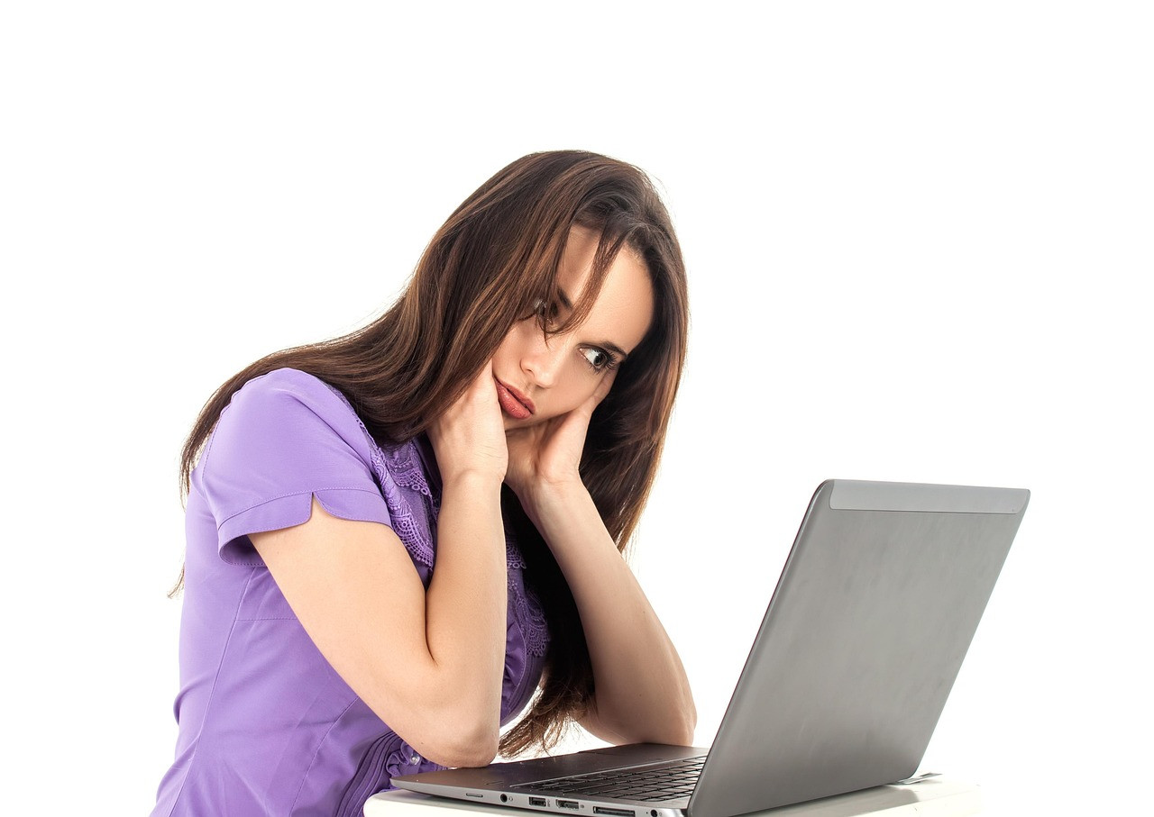 Representative image: woman thinking at desk