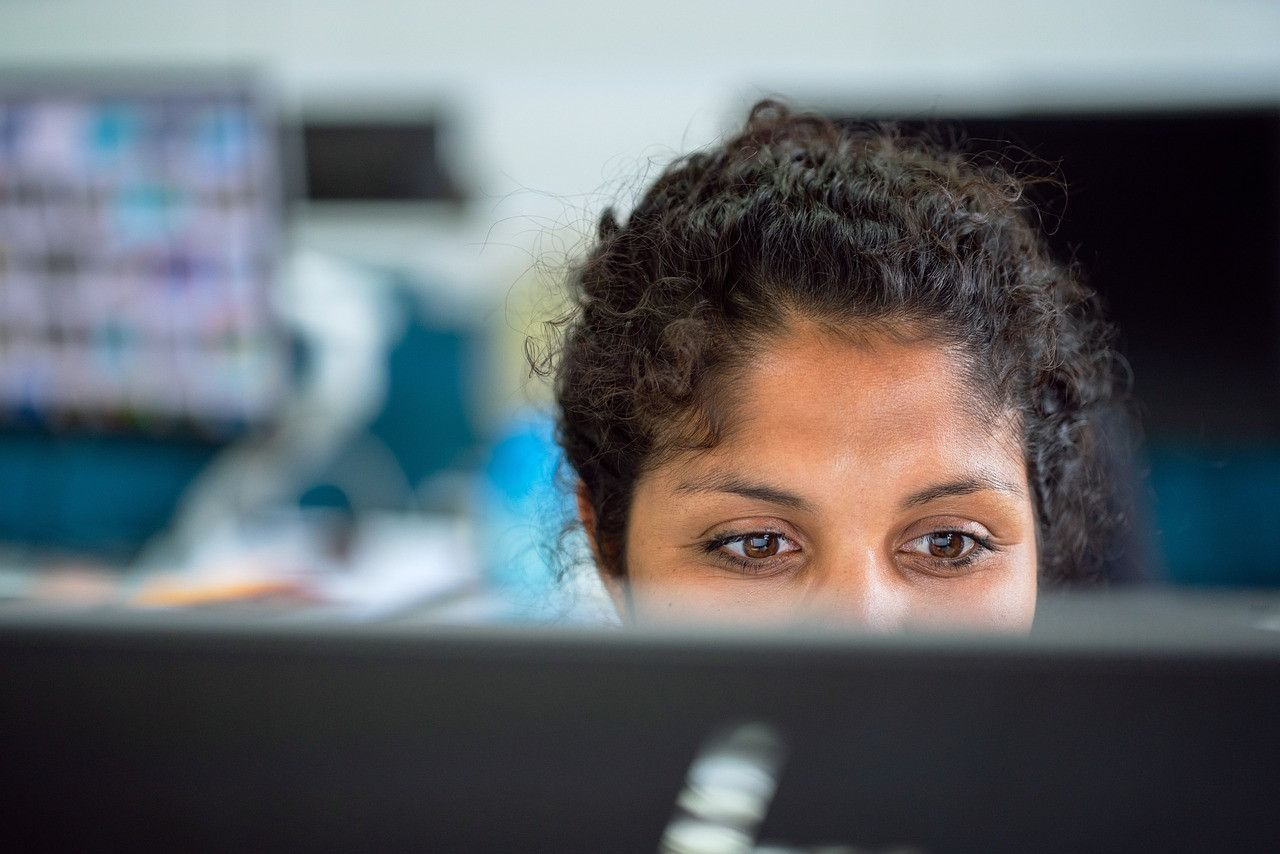 Representative image: woman thinking at office desk