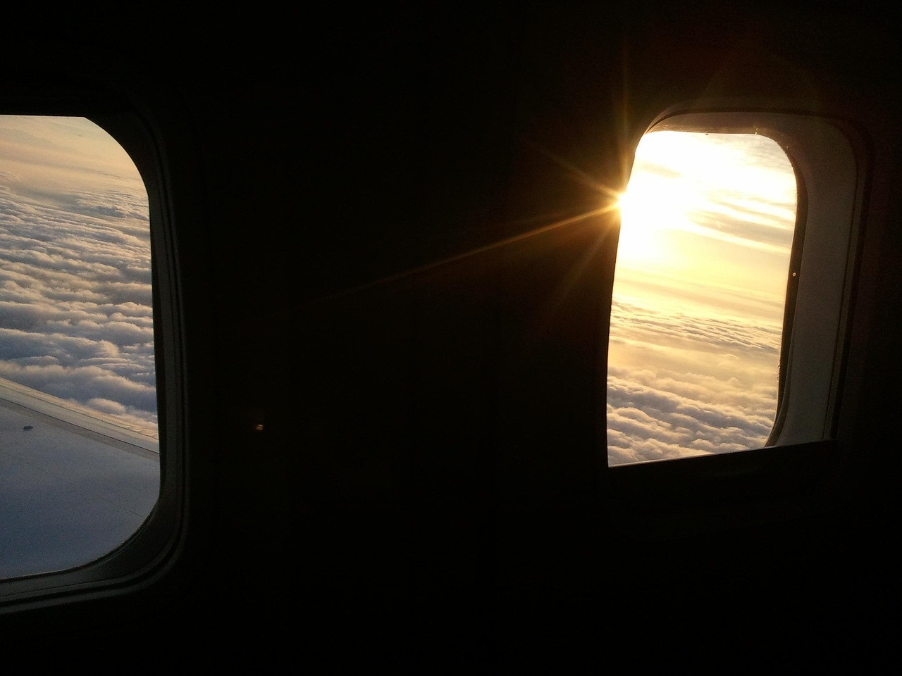 Representative image: airplane wing window clouds