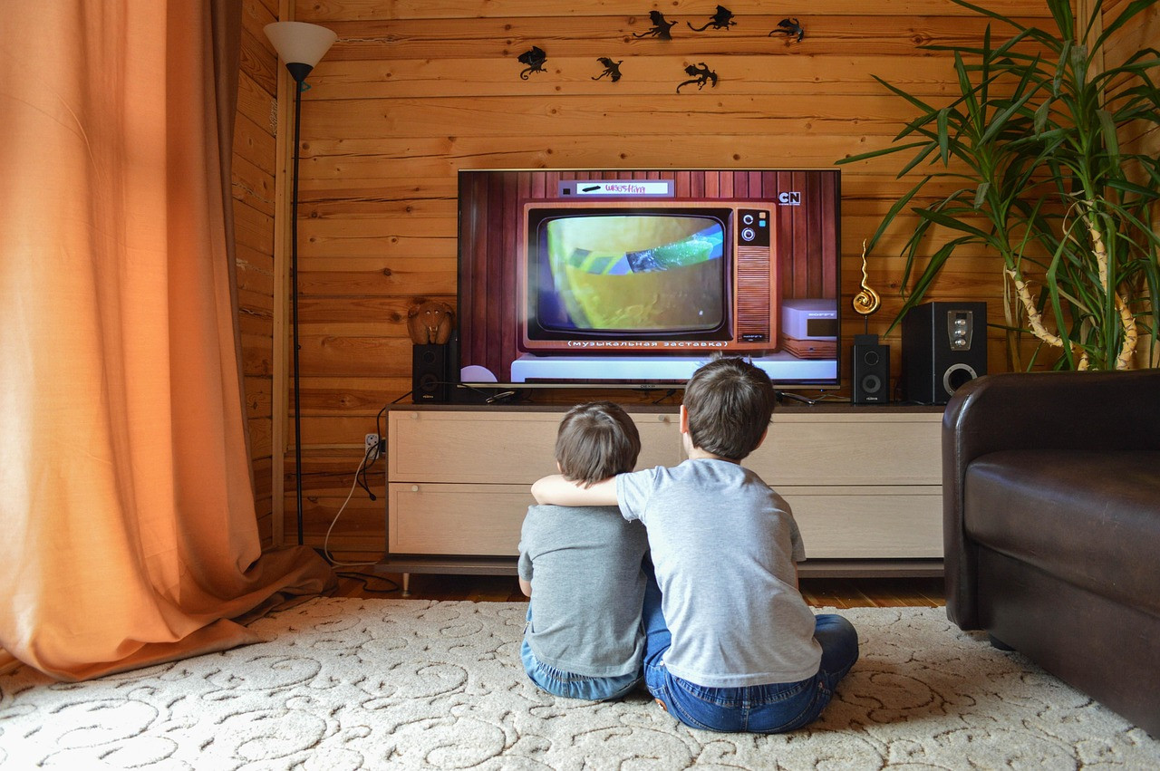 Representative image: family watching television sofa