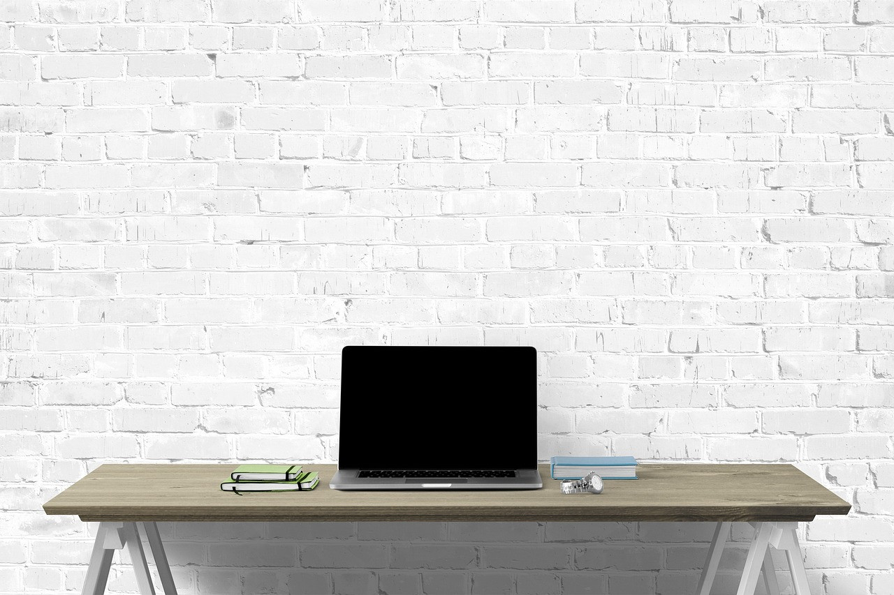 Representative image: empty office desk with laptop