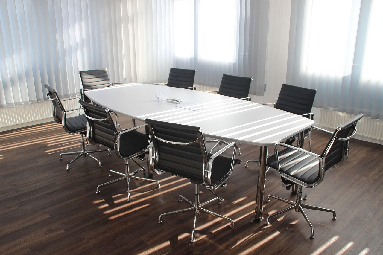 Representative image: empty office desks chairs