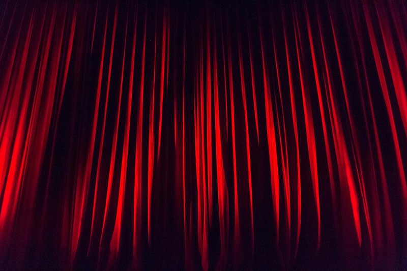 Representative image: theatre stage red curtains