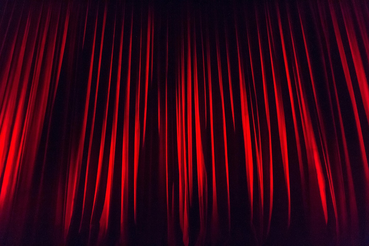 Representative image: theatre stage red curtains