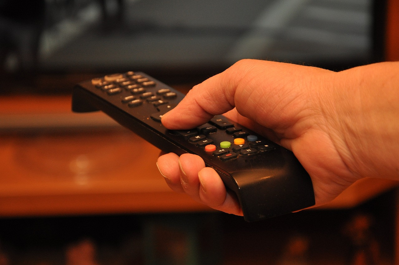 Representative image: person watching tv on sofa