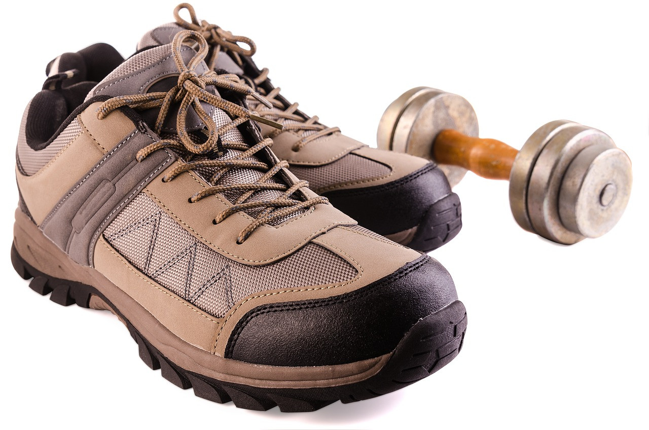 Representative image: dumbbells and sports shoes