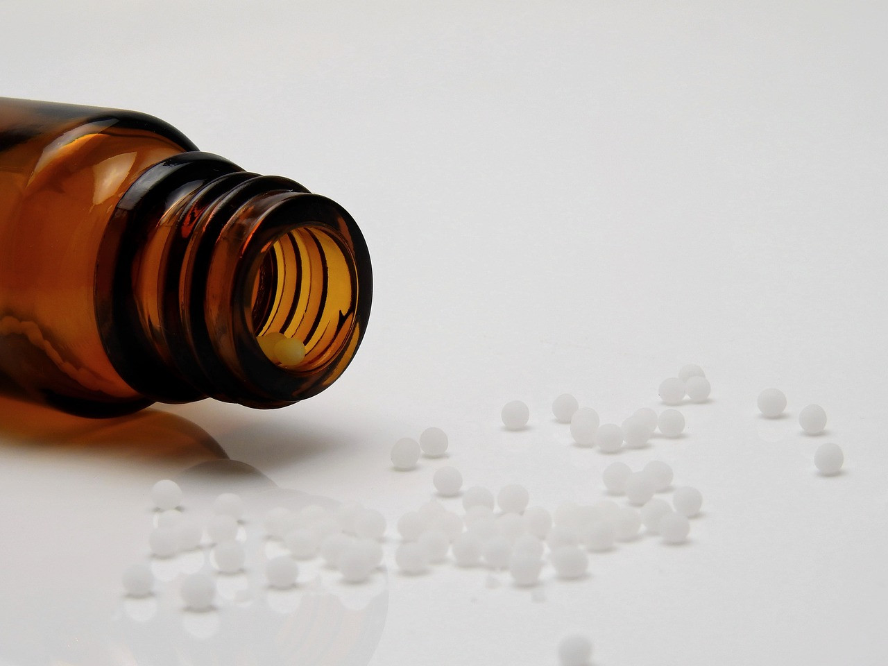 Representative image: homeopathy pills glass bottles
