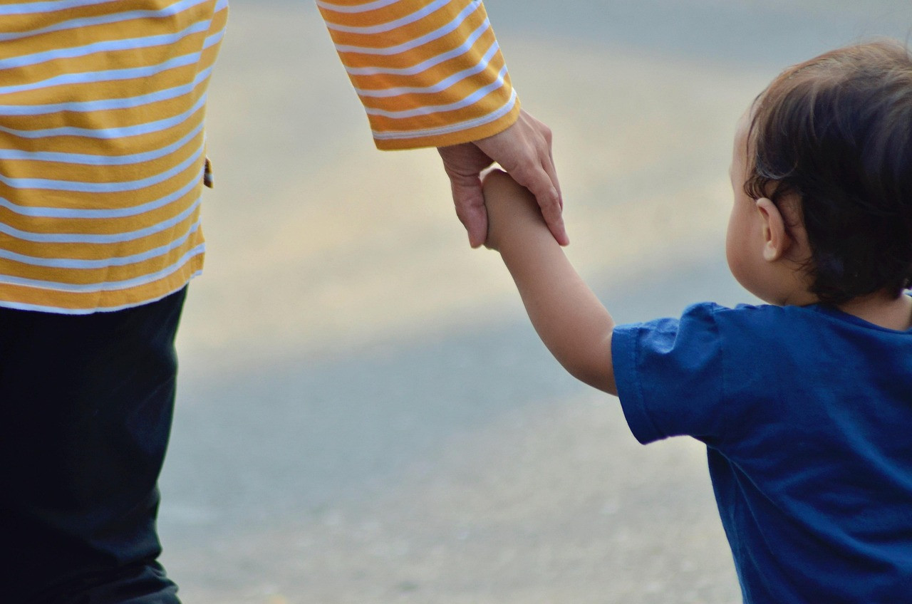 Representative image: mother holding child hand