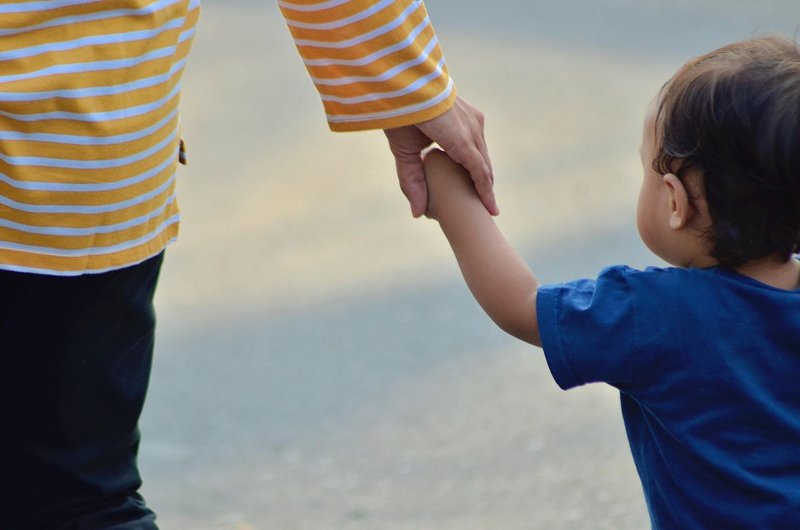 Representative image: mother holding child hand