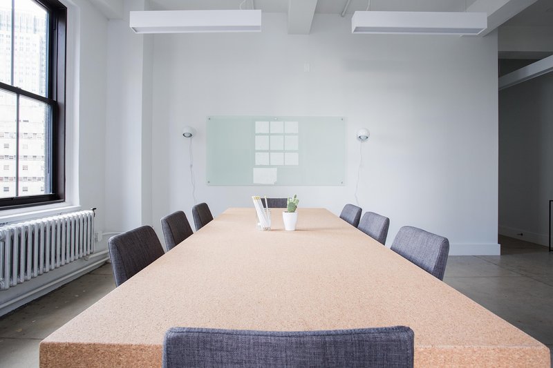 Representative image: empty office desks chairs