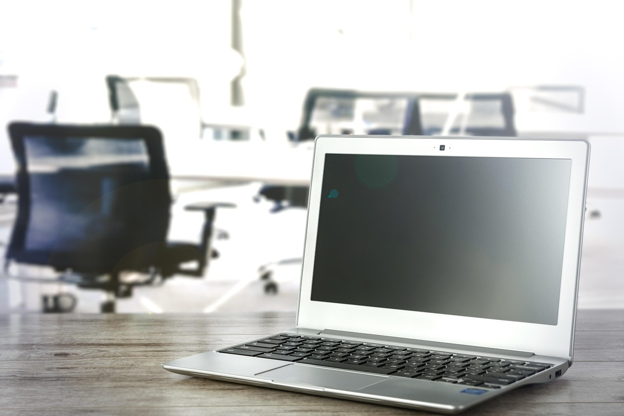 Representative image: empty office desks computers