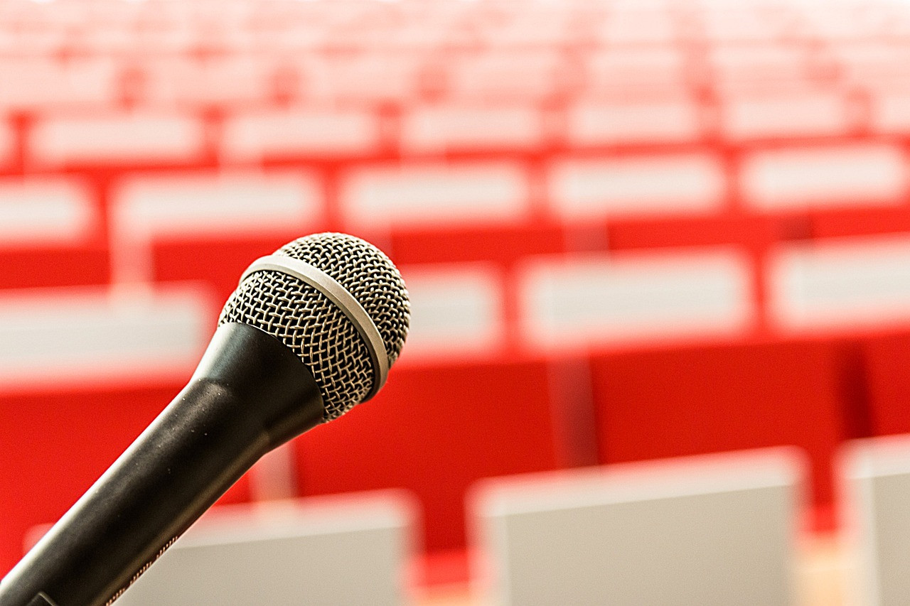 Representative image: podium microphones speech
