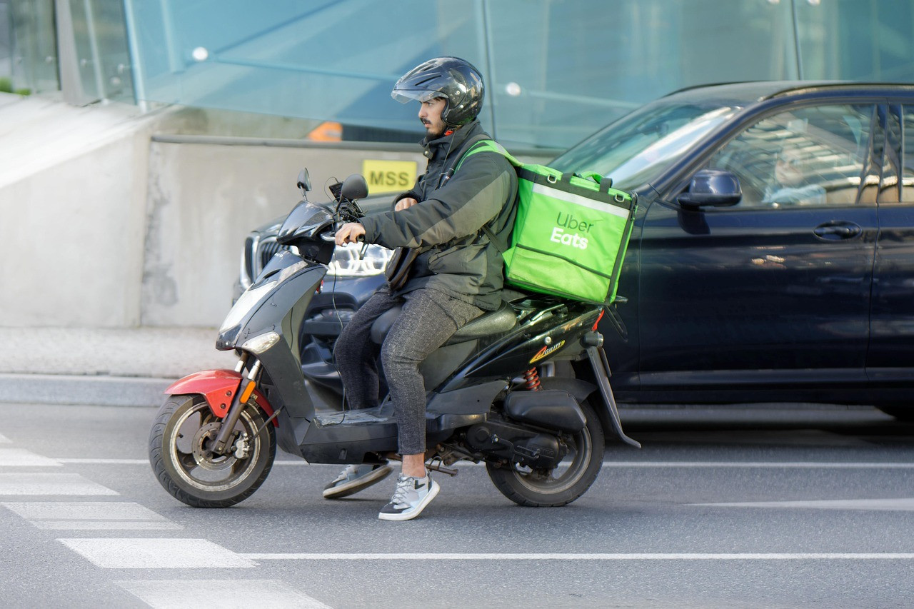 Representative image: delivery rider scooter groceries