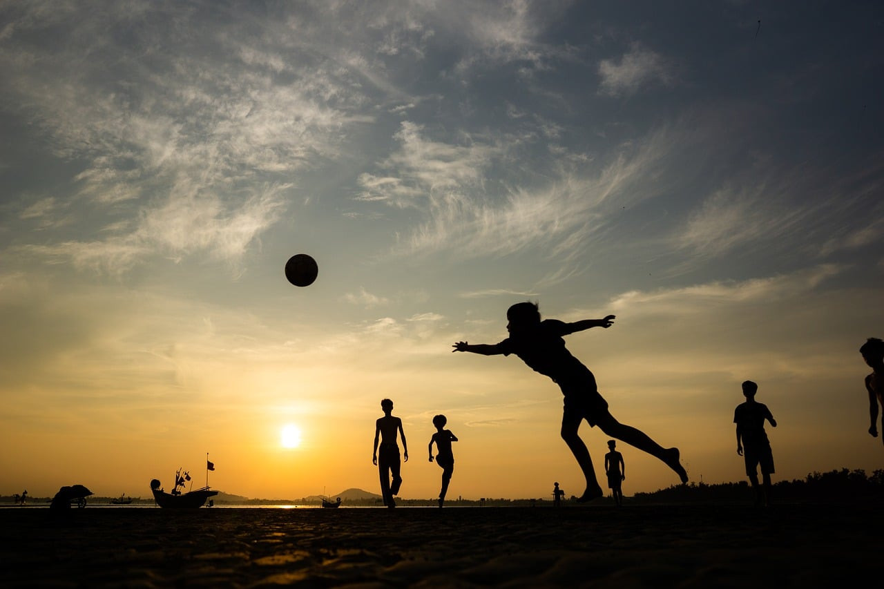 Representative image: children playing football in park
