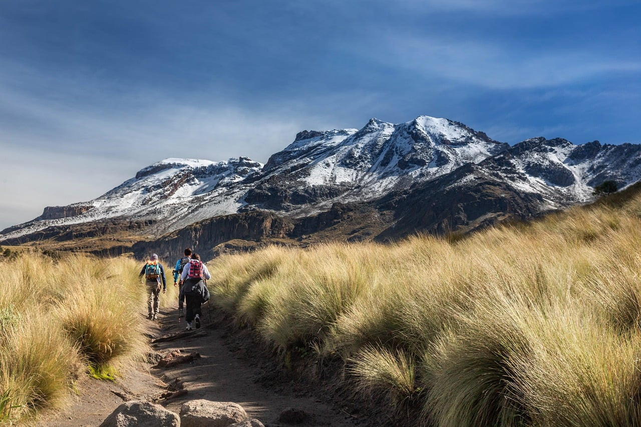Representative image: backpackers hiking mountain trail