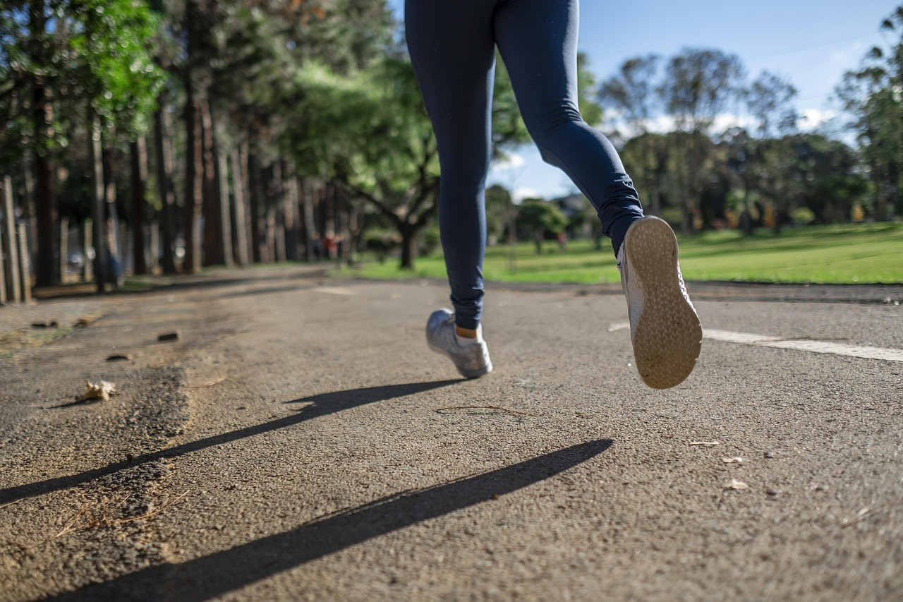 Representative image: woman jogging in a park