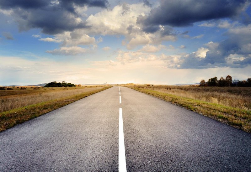 Representative image: highway road at sunset