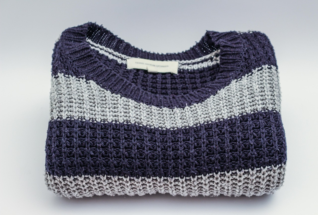 Representative image: folded knit sweaters on shelf