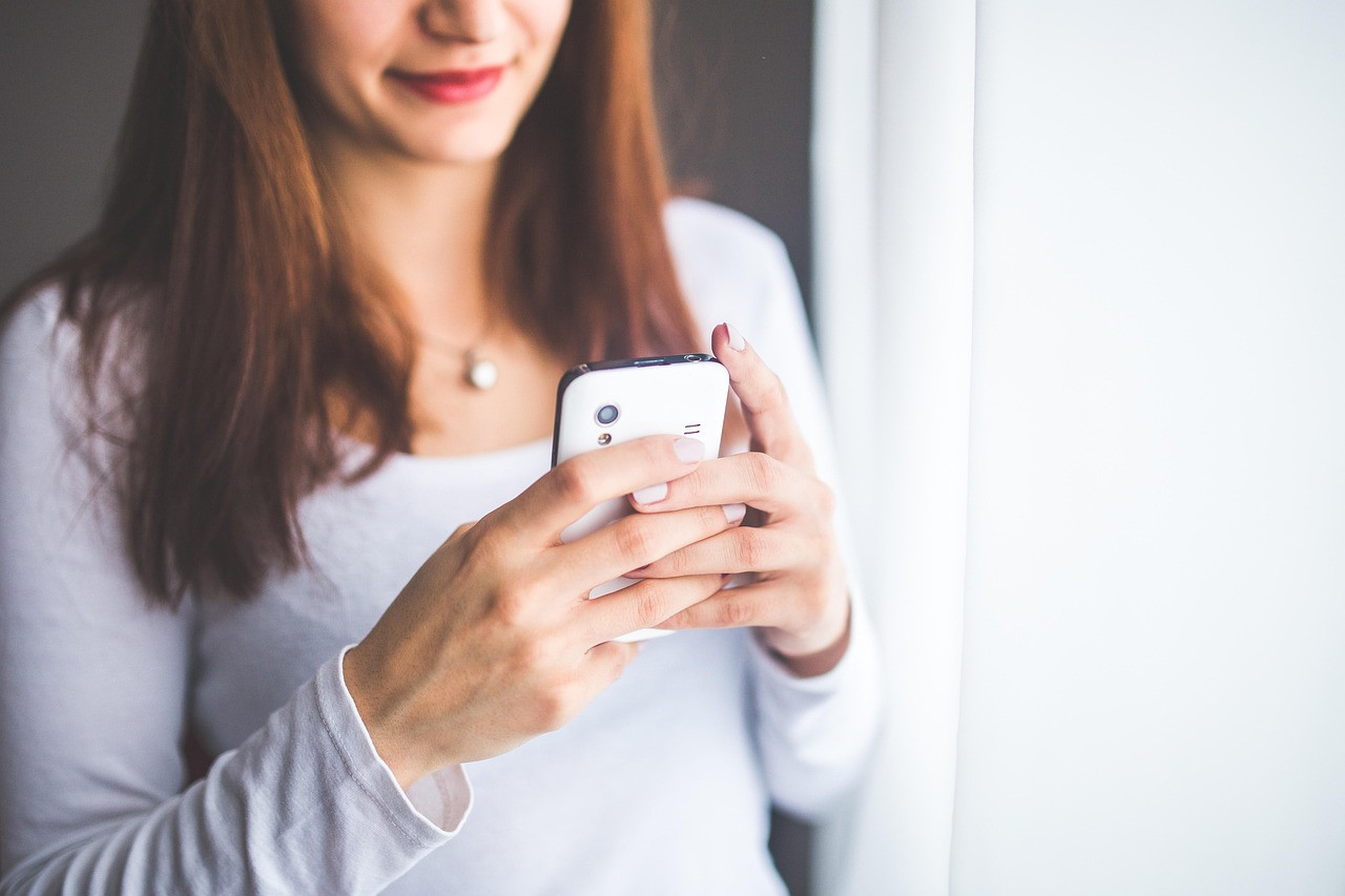 Representative image: hand holding smartphone