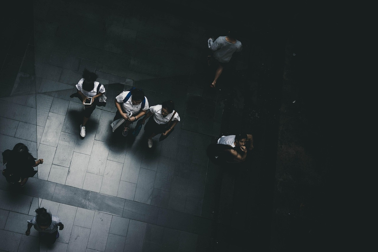 Representative image: young people walking on campus