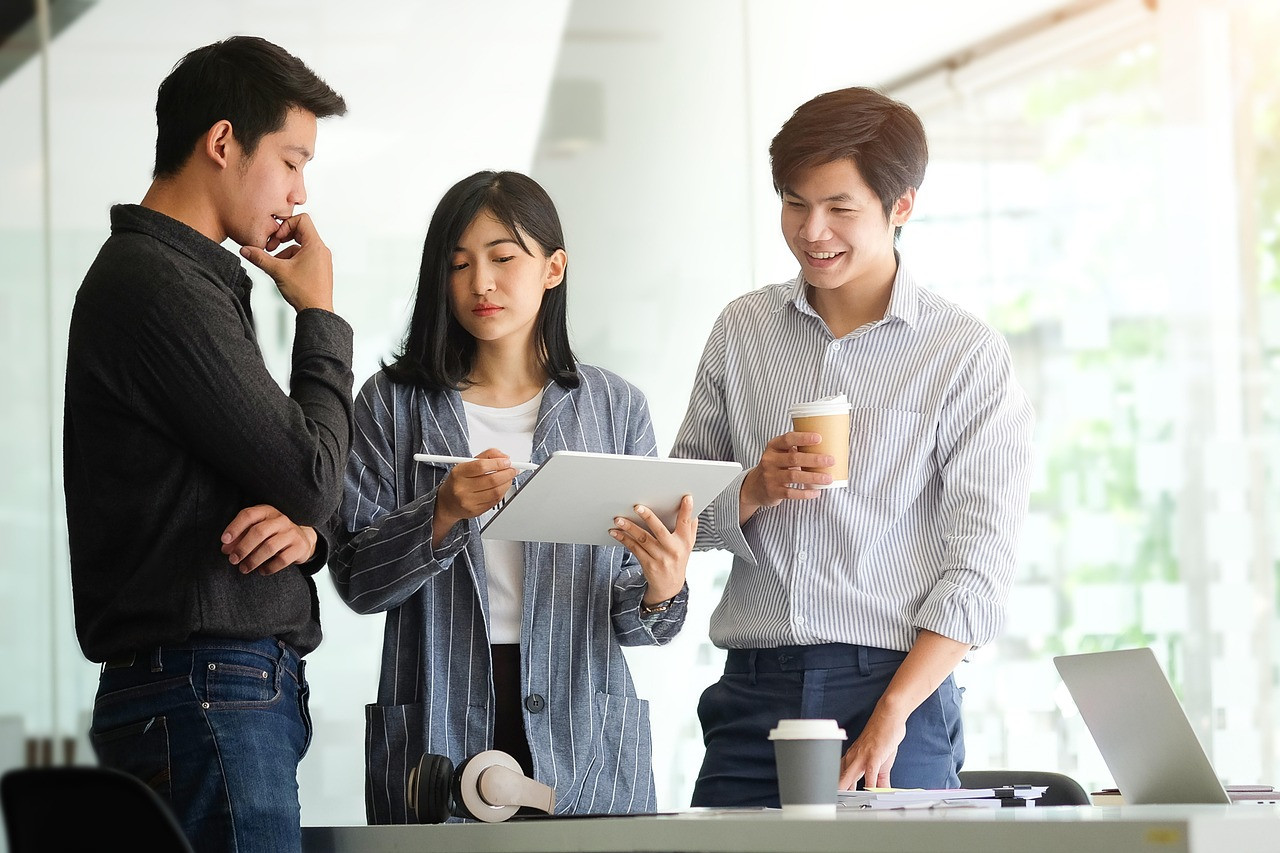 Representative image: young professionals office laptops