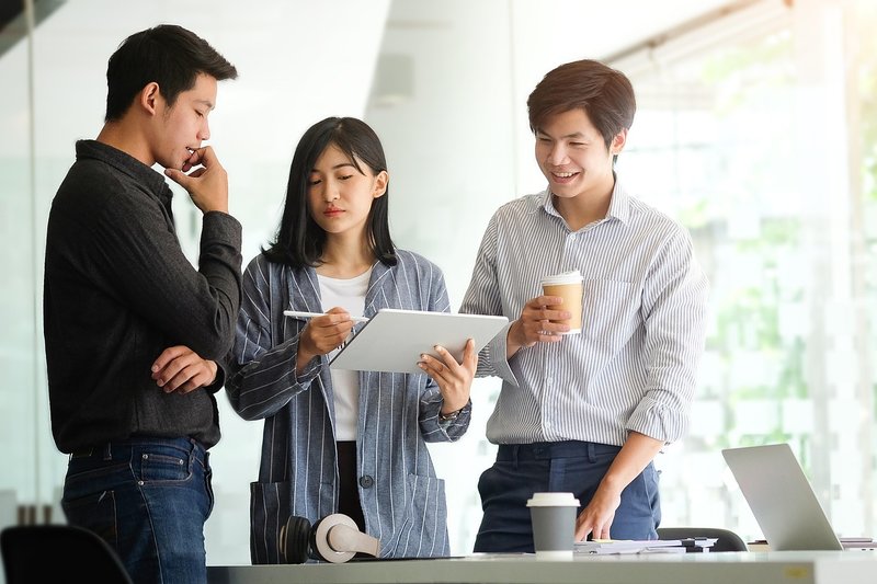 Representative image: young professionals office laptops