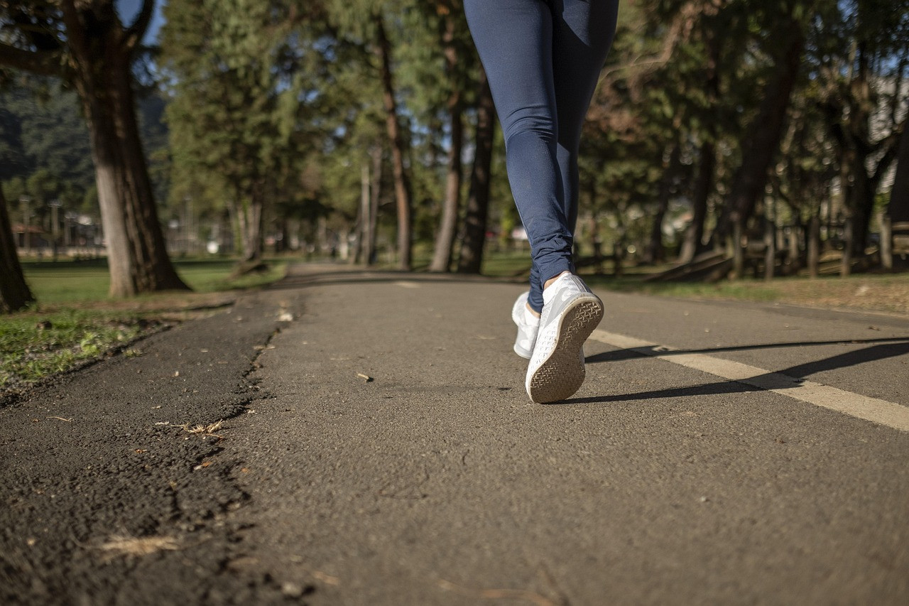 Representative image: woman jogging evening park