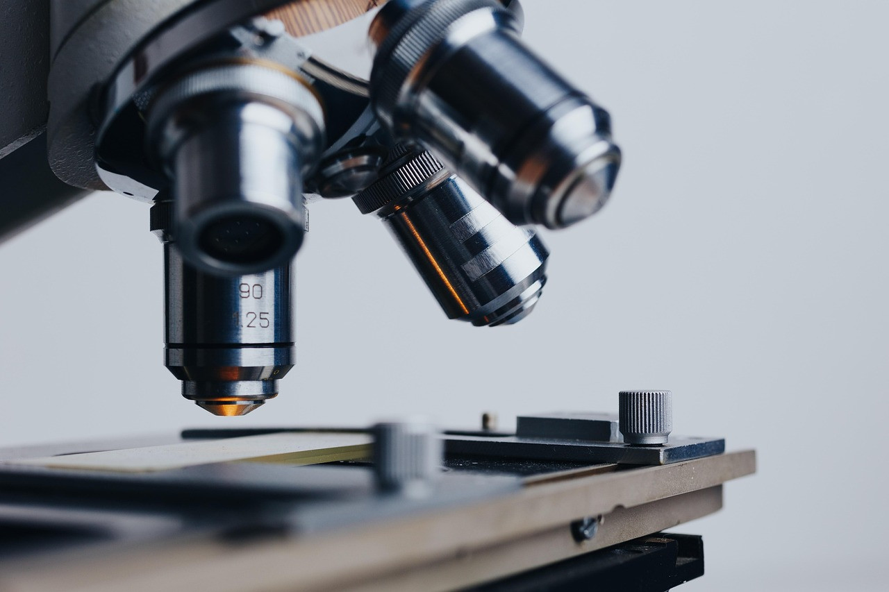 Representative image: scientist in laboratory with microscope