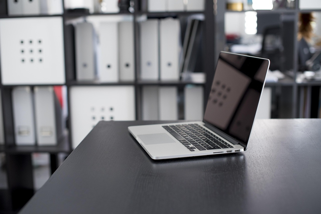 Representative image: office desks with laptops