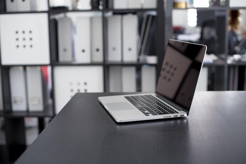 Representative image: office desks with laptops