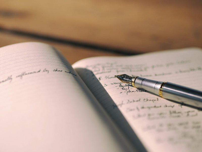 Representative image: open notebook pen