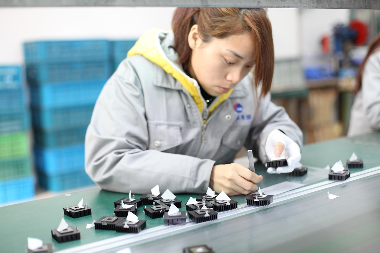 Representative image: factory workers assembly line