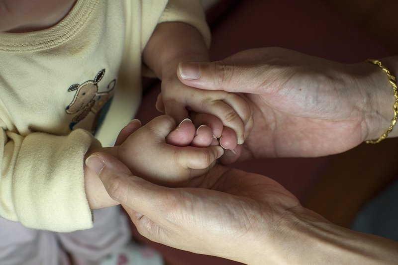 Representative image: mother holding toddler hand