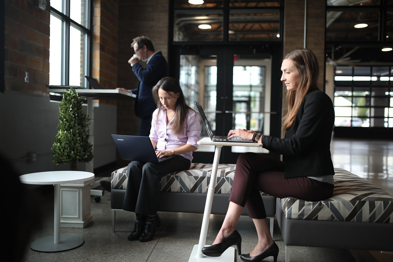 Representative image: office workers laptops modern office