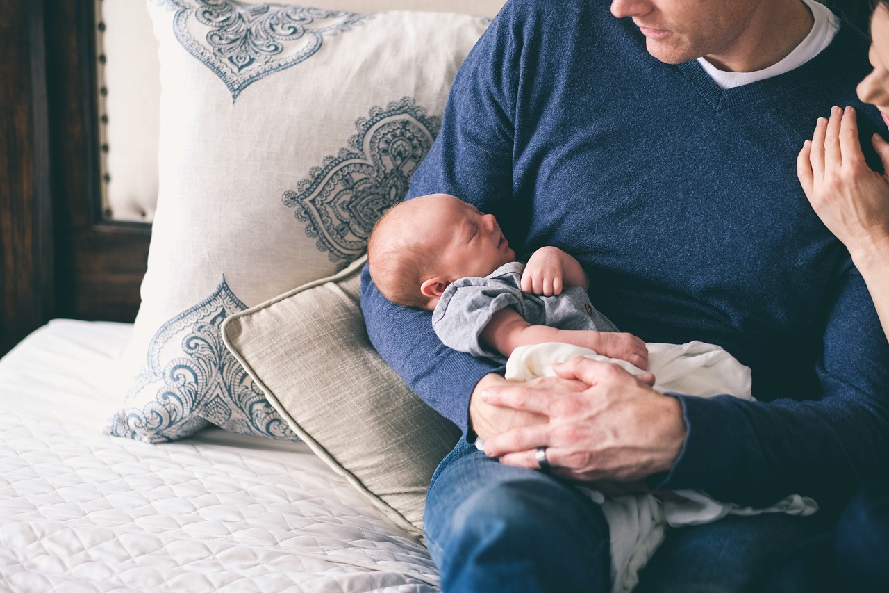 Representative image: father holding newborn baby