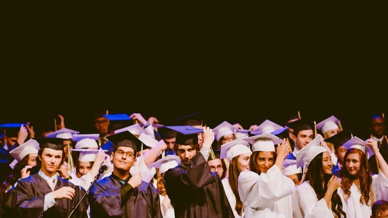 Representative image: graduates in caps and gowns