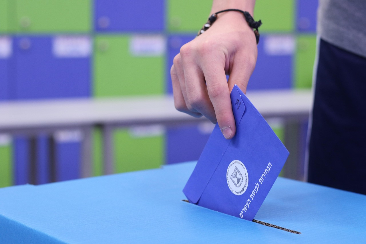 Representative image: ballot box voting hand