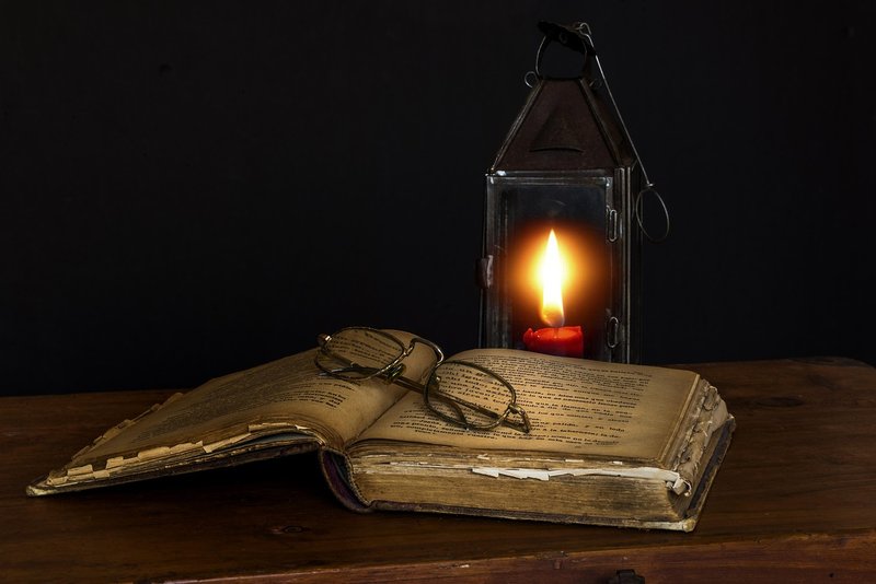 Representative image: old books and candles