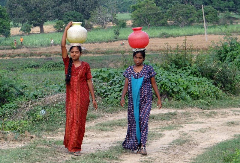 Representative image: woman carrying water pot