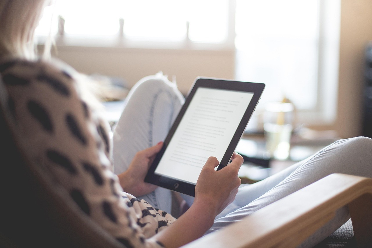 Representative image: e-reader and headphones