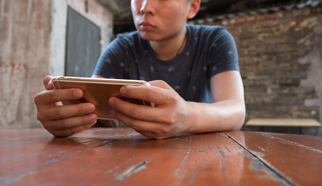 Representative image: mobile phone gaming hands