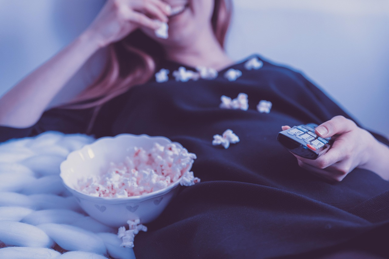 Representative image: family watching television sofa