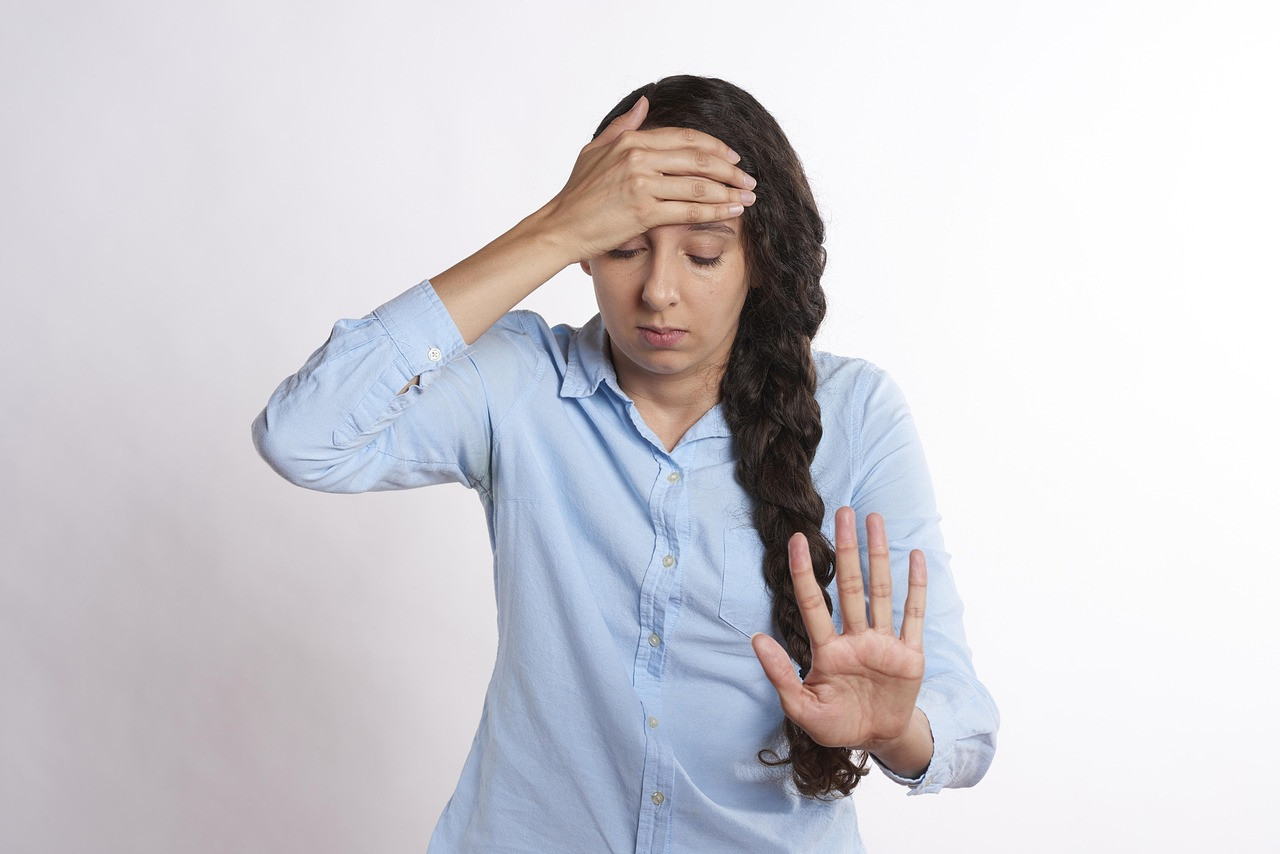 Representative image: woman with headache