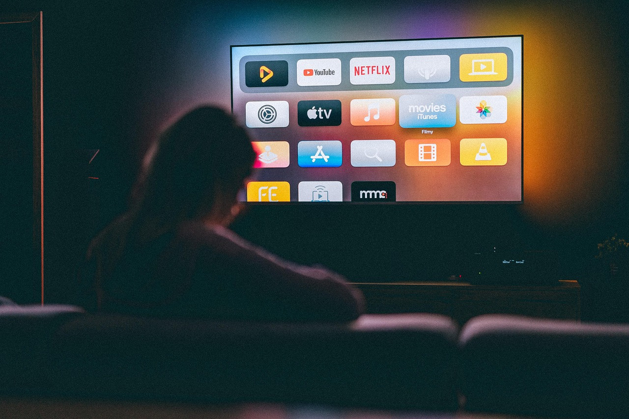Representative image: person watching television dark room