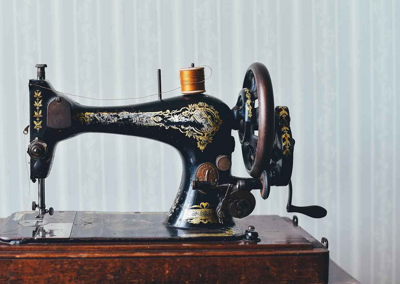 Representative image: woman tailor sewing machine shop